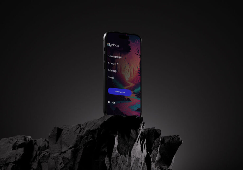 Smartphone displaying colorful website interface on rocky surface.
